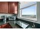 Kitchen with a granite countertop, toaster oven, and spice rack, complemented by a view of the ocean at 2071 S Atlantic Ave # 705, Daytona Beach, FL 32118
