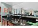 Contemporary kitchen featuring dark granite countertops and open layout at 2071 S Atlantic Ave # 705, Daytona Beach, FL 32118