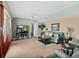 Comfortable living room featuring a couch, ceiling fan and large television at 2071 S Atlantic Ave # 705, Daytona Beach, FL 32118