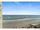 Stunning ocean view from a high-rise condo, showcasing the expansive coastline and serene beach at 2071 S Atlantic Ave # 705, Daytona Beach, FL 32118