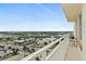 Balcony view overlooking the city with palm trees, the ocean and the surrounding neighborhood at 2071 S Atlantic Ave # 705, Daytona Beach, FL 32118