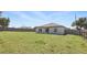 Beautiful backyard with a well-maintained lawn and fenced perimeter, perfect for Gathering enjoyment at 223 Courtland Blvd, Deltona, FL 32738