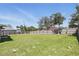 Expansive backyard with healthy green grass and a sturdy wooden fence at 223 Courtland Blvd, Deltona, FL 32738