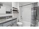 Well-lit bathroom features a granite vanity top and tiled shower, providing a clean and functional space at 223 Courtland Blvd, Deltona, FL 32738