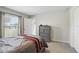 Comfortable bedroom featuring neutral colors and a view of the backyard at 223 Courtland Blvd, Deltona, FL 32738