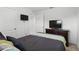 Bedroom with a TV, dresser, and neutral carpet providing a cozy space at 223 Courtland Blvd, Deltona, FL 32738