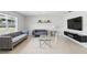 Contemporary living space with stylish sofas, a glass coffee table, and a large window at 223 Courtland Blvd, Deltona, FL 32738
