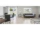 Modern living room with tiled flooring, neutral paint, and ample natural light at 223 Courtland Blvd, Deltona, FL 32738