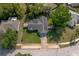 Bird's eye view of a home with solar panels, well-manicured lawn, and surrounding neighborhood at 227 Heronwood Cir, Deltona, FL 32725