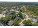 Aerial shot displaying home's location within a sprawling neighborhood with ample trees and greenery at 227 Heronwood Cir, Deltona, FL 32725