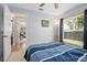Comfortable bedroom featuring a ceiling fan and a bright window with natural light at 227 Heronwood Cir, Deltona, FL 32725