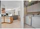 Laundry room adjacent to the kitchen offers lots of storage with a view to living space at 227 Heronwood Cir, Deltona, FL 32725