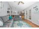 Open living room with hardwood floors, ceiling fan, and sliding doors to the backyard at 227 Heronwood Cir, Deltona, FL 32725