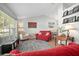 Bright living room with hardwood floors and natural light from a large window at 227 Heronwood Cir, Deltona, FL 32725