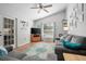 Cozy living room featuring a ceiling fan, lots of natural light, and comfortable seating at 227 Heronwood Cir, Deltona, FL 32725