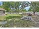 A large backyard with grass, trees, and a fenced in pool at 2355 W Orange Rd, Deland, FL 32724