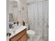 This bathroom offers a vanity with sink and a shower with a patterned curtain at 2355 W Orange Rd, Deland, FL 32724