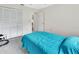 Comfortable bedroom with carpeting, ample natural light from a window, and double closet doors at 2355 W Orange Rd, Deland, FL 32724