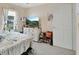 Comfortable bedroom featuring carpet, a ceiling fan, TV and a double window at 2355 W Orange Rd, Deland, FL 32724