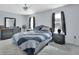 Cozy bedroom featuring a decorative gray dresser, complemented by a ceiling fan for added comfort at 2355 W Orange Rd, Deland, FL 32724