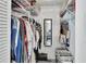 Walk-in closet with wire shelving, clothing and accessories offering ample storage space at 2355 W Orange Rd, Deland, FL 32724