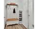 Entryway with hard surface flooring, coat rack, and view to adjacent rooms at 2355 W Orange Rd, Deland, FL 32724