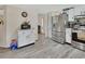 Kitchen featuring stainless steel appliances, white cabinets, hard surface flooring, and view into adjacent rooms at 2355 W Orange Rd, Deland, FL 32724