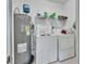 A laundry room features a washing machine, dryer, and water heater at 2355 W Orange Rd, Deland, FL 32724
