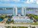 An aerial view of a modern condo building with waterfront views and convenient parking at 241 Riverside Dr # 2110, Daytona Beach, FL 32117
