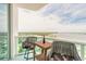 Cozy balcony showcasing comfortable seating and a table, perfect for enjoying the scenic views at 241 Riverside Dr # 2110, Daytona Beach, FL 32117