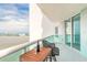 Private balcony with comfortable seating, ideal for enjoying sunsets and the views of the coast at 241 Riverside Dr # 2110, Daytona Beach, FL 32117