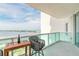 Balcony with a seating area offering scenic water and city views for relaxation and enjoyment at 241 Riverside Dr # 2110, Daytona Beach, FL 32117