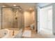 Bathroom featuring shower with glass door and patterned wall paper at 241 Riverside Dr # 2110, Daytona Beach, FL 32117
