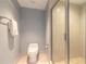 Contemporary bathroom featuring a glass-enclosed shower and modern toilet with bidet feature at 241 Riverside Dr # 2110, Daytona Beach, FL 32117