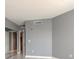 Neutral bedroom featuring gray walls, white trim, and closet with sliding mirrored doors at 241 Riverside Dr # 2110, Daytona Beach, FL 32117
