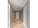 Hallway with modern recessed lighting and gray painted walls at 241 Riverside Dr # 2110, Daytona Beach, FL 32117