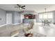 Open living area featuring a modern kitchen, dining area, and comfortable seating with tile flooring throughout at 241 Riverside Dr # 2110, Daytona Beach, FL 32117