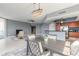 Open-concept space with dining area and kitchen, featuring bright natural light, tile flooring and modern appliances at 241 Riverside Dr # 2110, Daytona Beach, FL 32117