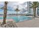 Resort-style pool area surrounded by lush landscaping, offering a relaxing oasis for residents at 241 Riverside Dr # 2110, Daytona Beach, FL 32117