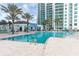 Beautiful community pool and palm trees offering luxurious resort-style living at 241 Riverside Dr # 2110, Daytona Beach, FL 32117