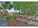 Beautiful backyard featuring a cozy hammock, lush landscaping, and ample space for outdoor relaxation and entertainment at 2427 Beck Cir, Deltona, FL 32738