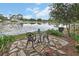 Scenic backyard offers a serene seating area with water view, perfect for relaxing and enjoying nature at 2427 Beck Cir, Deltona, FL 32738