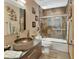 Unique bathroom boasting stone sink, stylish tile work, and sleek glass shower at 2427 Beck Cir, Deltona, FL 32738