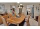 Dining room showcasing wood table set, built-in cabinet, and views into other rooms at 2427 Beck Cir, Deltona, FL 32738