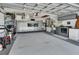 Clean and organized garage with ample storage cabinets and well-maintained appliances at 2427 Beck Cir, Deltona, FL 32738
