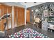 Home gym features workout equipment, a desk area, and plenty of storage at 2427 Beck Cir, Deltona, FL 32738