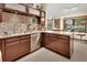 Modern kitchen with stainless steel appliances, granite countertops, and ample cabinet space at 2427 Beck Cir, Deltona, FL 32738