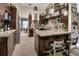Contemporary kitchen with stainless steel appliances, granite counters, and view into dining area at 2427 Beck Cir, Deltona, FL 32738