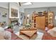 Stylish living room features a fireplace, display cabinet, and comfortable seating area with natural light at 2427 Beck Cir, Deltona, FL 32738
