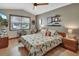 Bedroom featuring wood floors, natural light, ceiling fan, and neutral decor at 2427 Beck Cir, Deltona, FL 32738
